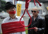 شاهد الصور... تظاهرة في هونغ كونغ للمطالبة بالإفراج عن 5 مفقودين يعملون في دار للنشر