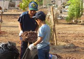بالصور... أهالي النعيم يطلقون حملة لتنظيف مقبرة المنطقة بالتعاون مع الجمعية الخيرية