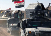 القوات العراقية تقول إنها تقترب من مطار الموصل