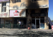 بالفيديو والصور... أضرار بمبنى ومحل تجاري بعد حريق اندلع بمركبة  في داركليب